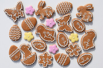 Romantic decorated Easter gingerbread cookies of various shapes, white background