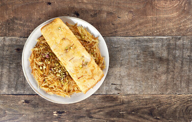 Traditional Arabic breakfast Balaleet - sweet vermicelli with saffron, cardamom and egg omelette. Copy space.