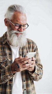 Senior man looking at his phone and smiling
