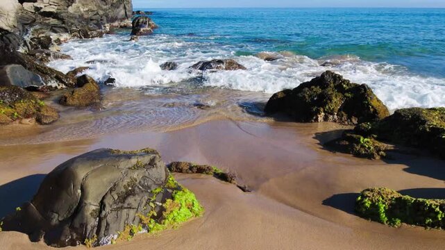 Waves Washing Over Boulders From Makaluapuna Point on Fleming Beach With Molokai Island Across Honokahua Bay, DT Fleming Beach Park, Kapalua, Maui, Hawaii, USA