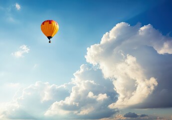 Obraz premium Colorful hot air balloon soaring through a clear blue sky