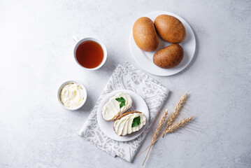 Rye buns with butter topping in a plate