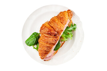Sandwich croissant ham, cheese, green leaf salad delicious gourmet food background on the table rustic food top view copy space