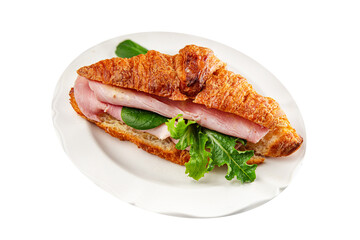 Sandwich croissant ham, cheese, green leaf salad delicious gourmet food background on the table rustic food top view copy space