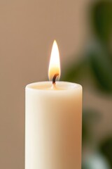 Soft glow of candle flame illuminates serene setting, creating c