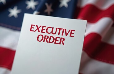 Close-up of Executive Order inscription over US flag. Image evokes message of American governance, presidential decrees, political agenda. Symbol of power, authority, law. Focus on national policy,