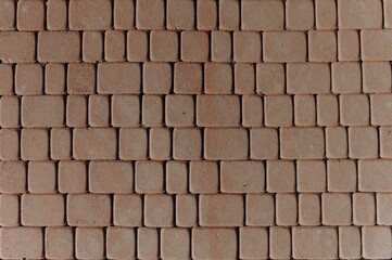 A detailed view of interlocking pavement blocks showcasing a textured surface and earthy tones, suitable for landscaping or outdoor flooring projects.
