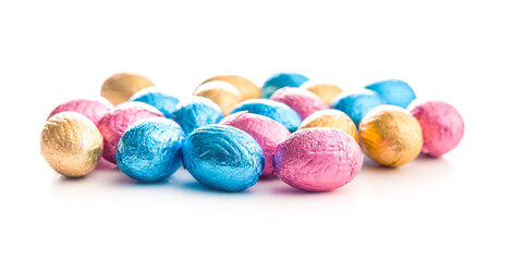 Chocolate easter eggs wrapped in multi colored foil isolated on white background.