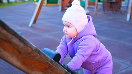 Child Enjoying Playground Activity on a Sunny Day in an Urban Neighborhood During Late Afternoon Hours