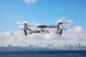 Drone with camera flying over sea. Unmanned aerial vehicle for surveillance