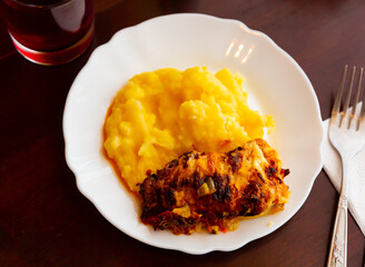 Chicken fillet with mushrooms and mashed potatoes. Modern Russian or Belarusian cuisine