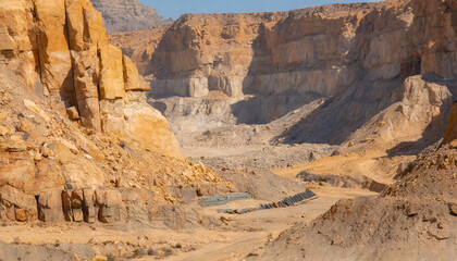  A desert mining ground surrounded by sheer rock cliffs 
