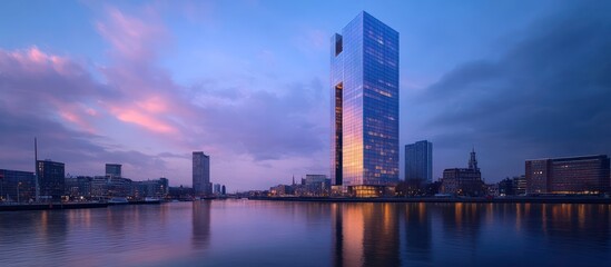 Naklejka premium Cityscape dawn, river, skyscraper reflection