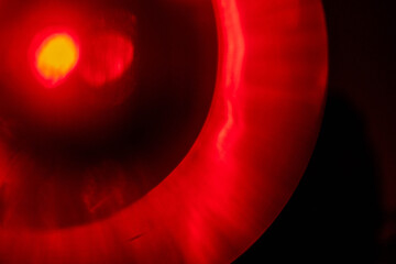 Red light leaks on dark background. Abstract background for design with random shapes. Colorful...