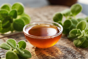 Plectranthus or Coleus amboinicus syrup for common cold in a glass bowl