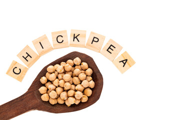 Organic dried chickpeas on a wooden spoon - Cicer arietinum.