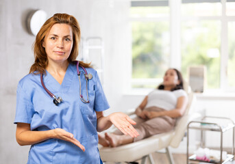 Asian woman waiting a facial beauty procedure by professional medicine worker in a hospital