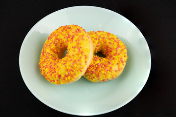Golden Donuts on a Black Background