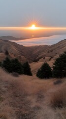 Fototapeta premium Golden Sunset Over Misty Valley.