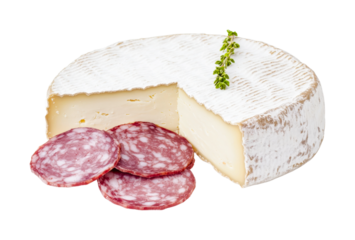 Round brie cheese with slices of salami and herb garnish, cut out