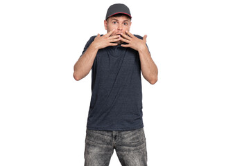 A young man in a gray shirt and cap showing a surprised expression with hands on his face.