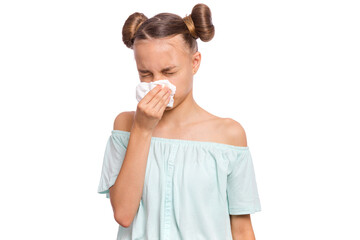 A young girl with pigtails using a tissue to wipe her nose, looking upset against a white background.