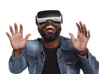 Man enjoying virtual reality gaming with VR glasses while smiling indoors during daylight hours
