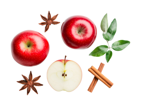 Fresh red apples with cinnamon and star anise on black background, cut out