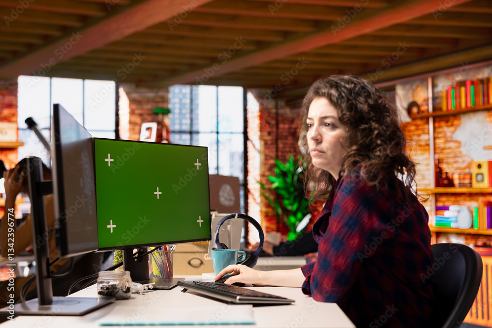 Poster technician using isolated screen computer to do maintenance on artificial intelligence neural networ