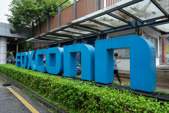Shenzhen, Guangdong, China - Apr 8, 2024: Foxconn sign is seen at the main entrance to the company's Longhua factory in Shenzhen, China. Foxconn is a multinational electronics contract manufacturer.