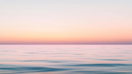 Obraz premium Imagine a tranquil scene featuring a softly blurred sunset sky where gentle pink gradients beautifully merge with the calm ocean below, evoking deep feelings of serenity, peace, and relaxation