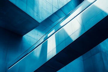 Fototapeta premium Ascending Modernity: A cool, serene journey up sleek metallic escalators within a minimalist concrete structure bathed in cool blue light.