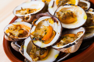 Delicious baked in oven Dog cockles (bivalve shellfishes) served in bowl