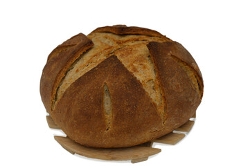 Warm and crusty artisanal bread resting on a wooden board in a cozy kitchen ambiance during the afternoon