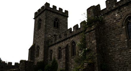 Ancient Stone Church Building Exterior with Crenellations and Gothic Windows