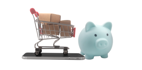 Shopping cart with piggy bank on smartphone online shopping e-commerce digital finance close-up view investment concept