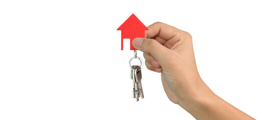 Hand holding red house keychain real estate transaction indoor setting bright environment close-up view home ownership concept