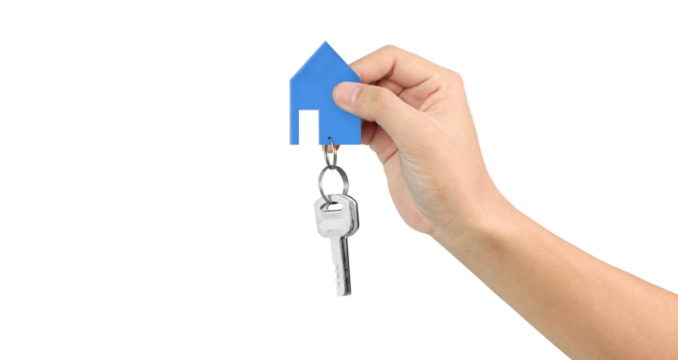 Hand holding house key and blue paper house symbolizing new home ownership indoor setting real estate concept close-up view for seo impact