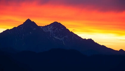 Fiery Sunset over Majestic Mountain Peaks Dramatic Landscape Photography