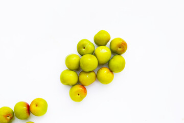 Fresh green plum on white background
