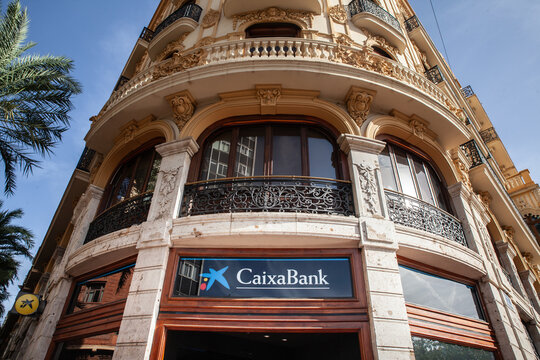 VALENCIA, SPAIN - OCTOBER 13, 2024: The CaixaBank logo on their office in Valencia. Caixa Bank is a spanish bank and a financial service group.
