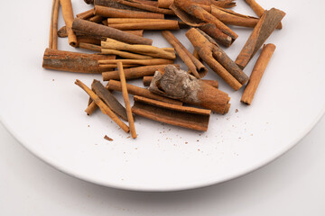 This image captures the warm, rustic charm of cinnamon sticks, showcasing their natural textures and rich, brown hues. 