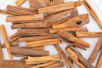 This image captures the warm, rustic charm of cinnamon sticks, showcasing their natural textures and rich, brown hues. 