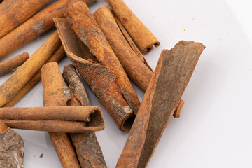 This image captures the warm, rustic charm of cinnamon sticks, showcasing their natural textures and rich, brown hues. 