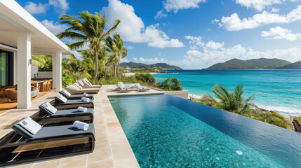 Fototapeta premium Breathtaking Luxury Pool Overlooking the Ocean with Relaxing Deck Chairs on a Bright, Sunny Day, Perfect Coastal Retreat Setting