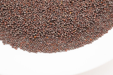 Immerse yourself in the intricate texture of these mustard seeds, captured in a detailed close-up. 