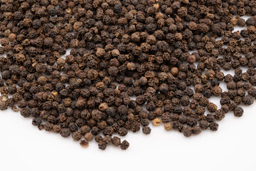 Capture the intense aroma and bold flavor with this detailed close-up of black peppercorns. 