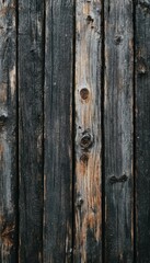 Fototapeta premium Weathered wooden planks, showing age and texture. Dark, gray, and brown tones create a rustic appeal.