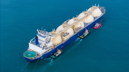 LNG (Liquified Natural Gas) tanker anchored in Gas terminal gas tanks for storage. Oil Crude Gas...