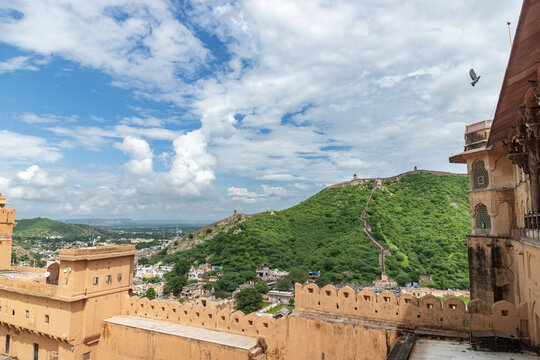 Amber Fort, a palace complex and military fortress in Amber, offers a stunning view of the Sun Gate, the Aravalli mountain range in the background, and the city wall.